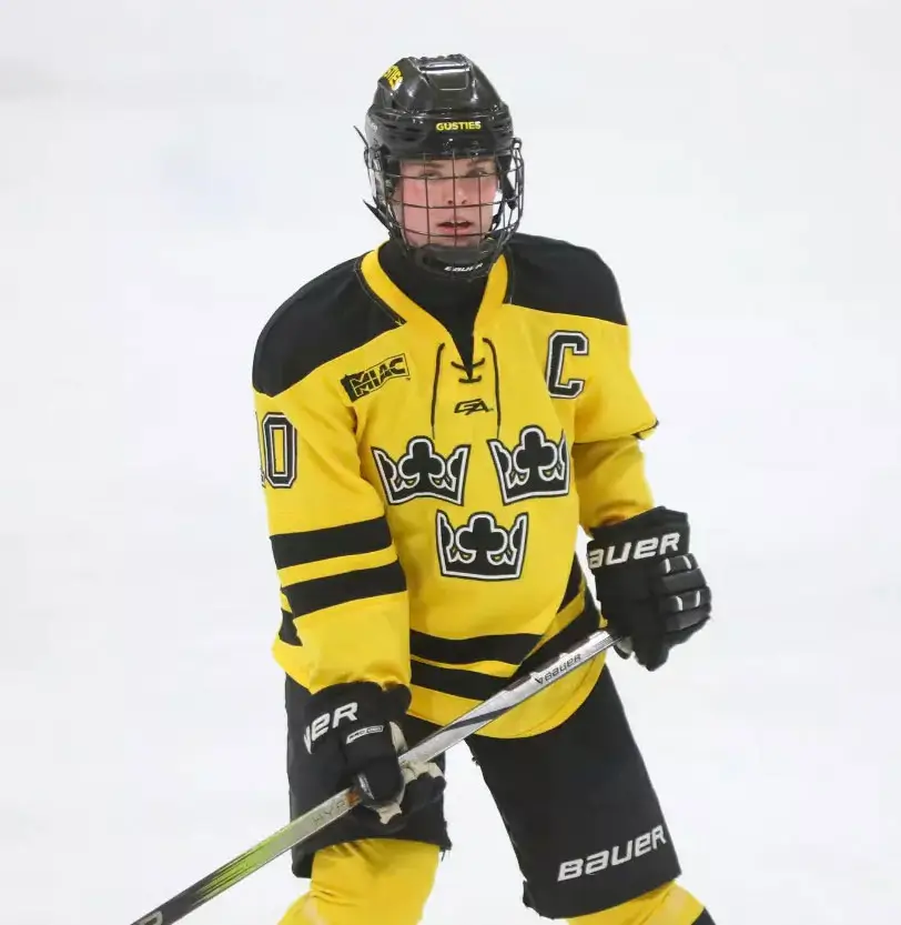 Kylie Scott playing hockey for Gustavus Adolphus College