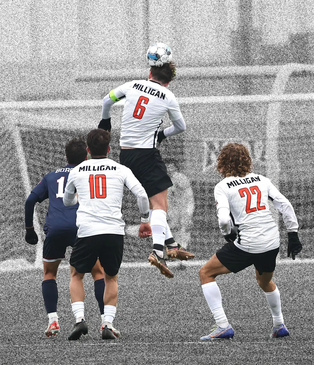 Milligan soccer players going up for a header